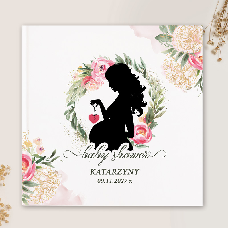 Okładka księgi na baby shower z sylwetką kobiety w ciąży trzymającej serce, otoczoną kolorowymi kwiatowymi elementami.