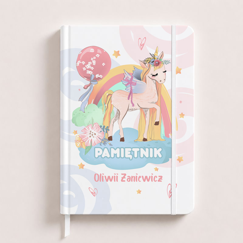Notes with a colorful unicorn design, featuring a rainbow, balloons, and the title "PAMIĘTNIK" along with the name "Oliwii Zanicwicz."