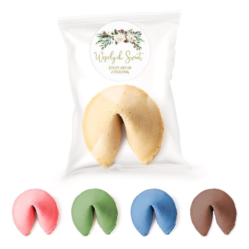 Opakowanie z wróżbą w kształcie ciasteczka fortuny, obok pięć kolorowych ciasteczek w odcieniach różowym, zielonym, niebieskim, brązowym i beżowym z napisem "Wesołych Świąt" na etykiecie.