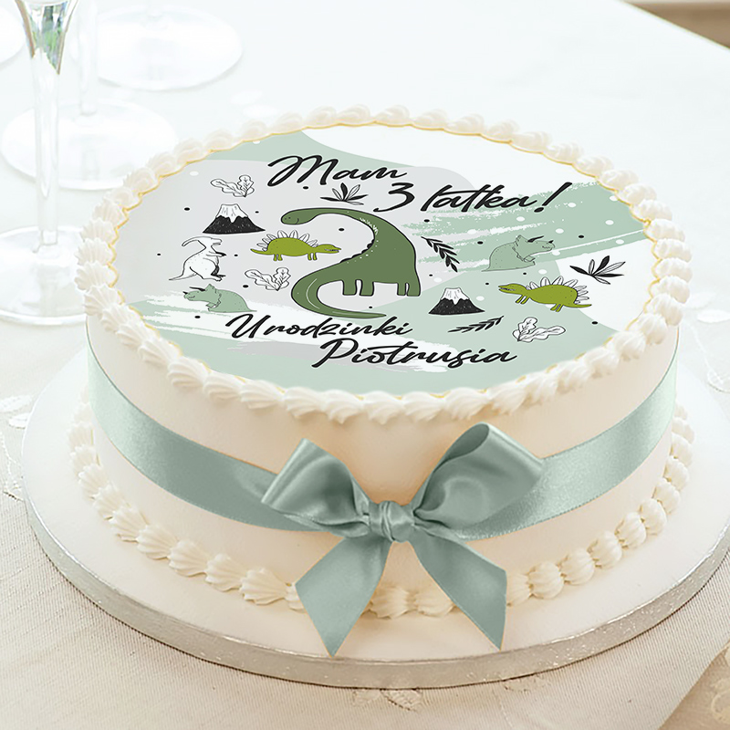 Opłatek na okrągły tort z motywem dinozaurów. Dekoracja na urodziny chłopca.