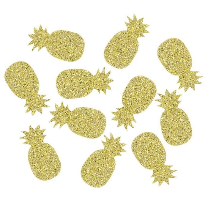 Złote brokatowe wycinanki w kształcie ananasów ułożone na białym tle.