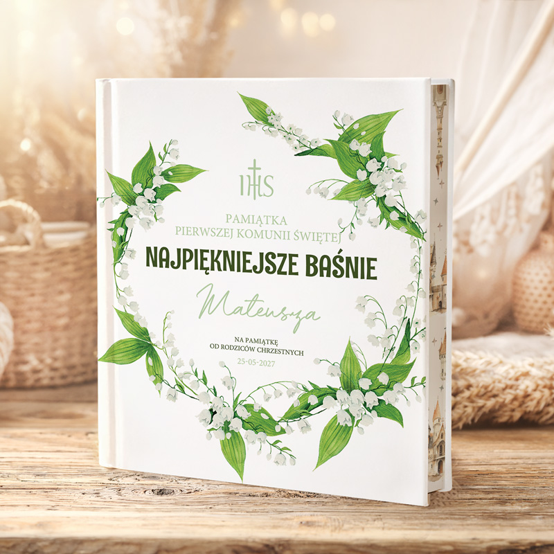 Księga z zielonymi liśćmi i białymi kwiatami, z napisem "Najpiękniejsze Baśnie" oraz imieniem Mateusz, datą 25-06-2027.