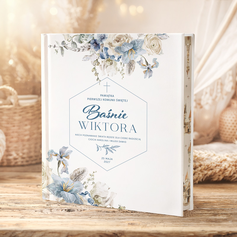 Książka pamiątka Pierwszej Komunii Świętej z napisem "Baśnie Wiktora" na tle kwiatowego wzoru. Data 25 maja 2027.