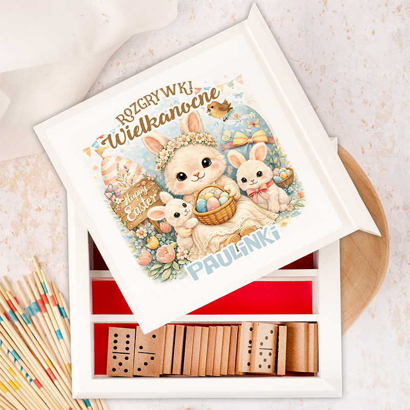 Grafika przedstawia kolorowe opakowanie z królikami na Wielkanoc, z napisem "Rozrywki Wielkanocne" i imieniem "Paulinka".