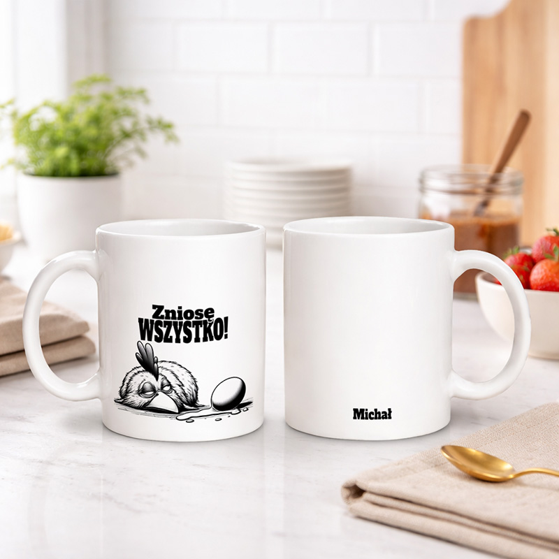 Kubek z napisem "Zniosę wszystko!" oraz ilustracją kury i jajka.
