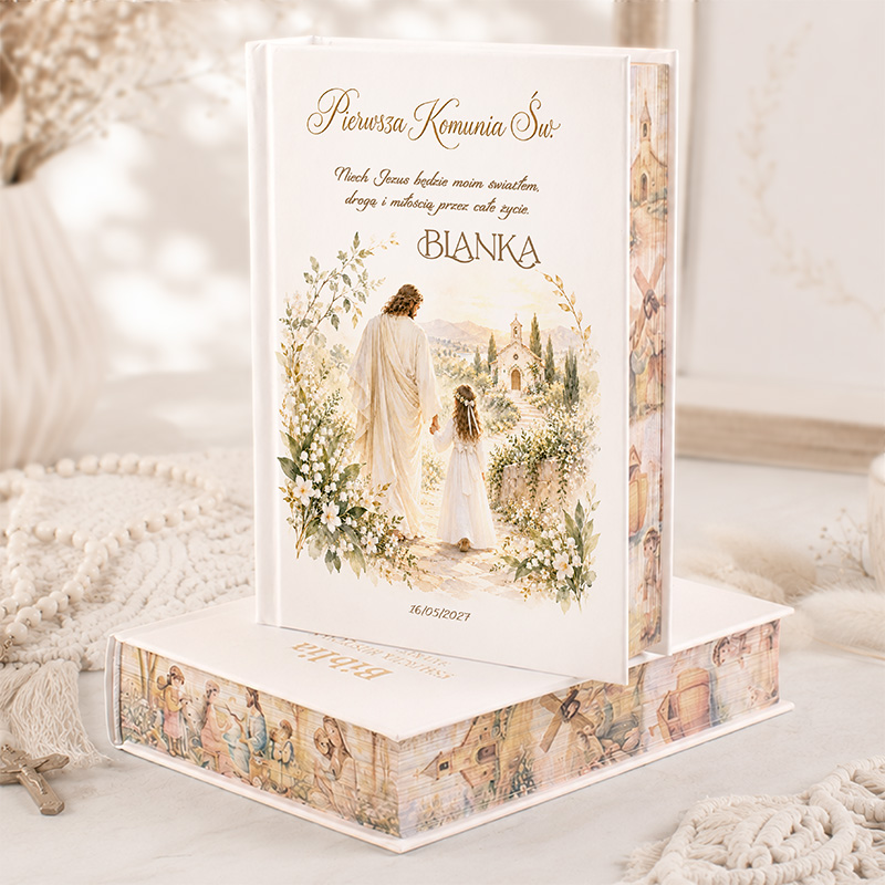 Elegancka biblia na Pierwszą Komunię Świętą z ilustracją Jezusa i dziewczynki w otoczeniu natury.